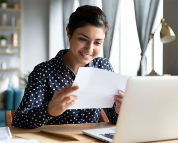 woman reading at laptop