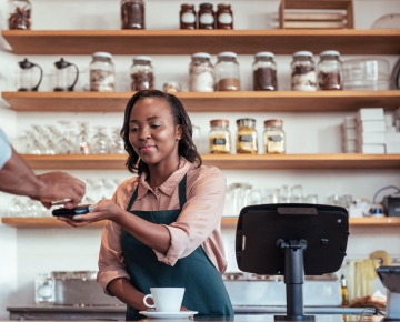 woman accepting mobile payment from customer