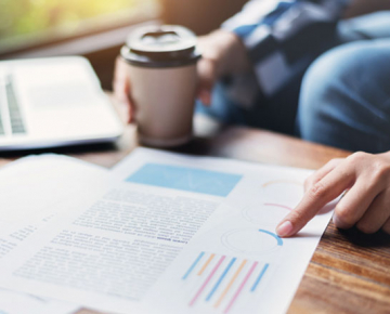 Person At Home Studying Documents