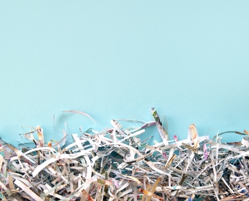 shredded paper blue background
