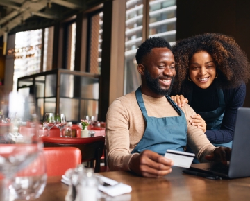 Business Owners Looking at Computer