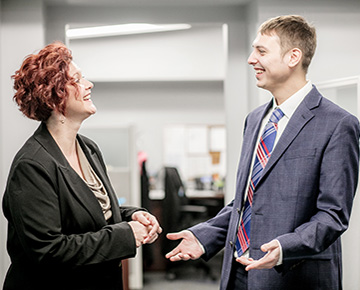 Two Employees Talking to Each Other