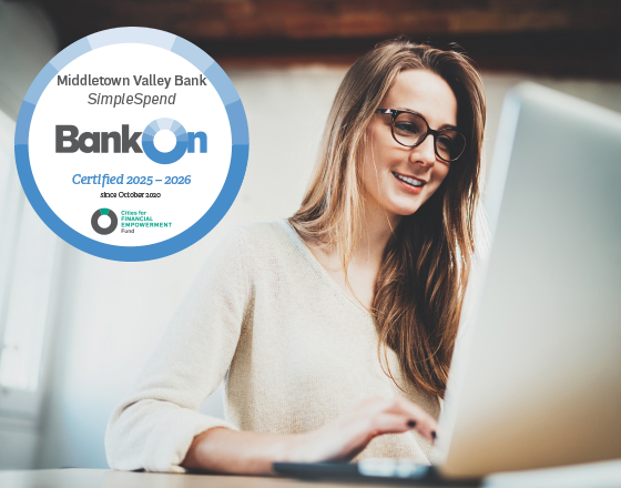 Girl Using Computer With Bank On Approved Seal On Top